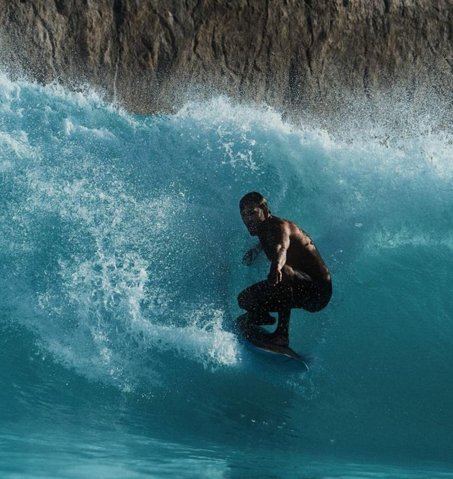 A diver beneath a breaking wave